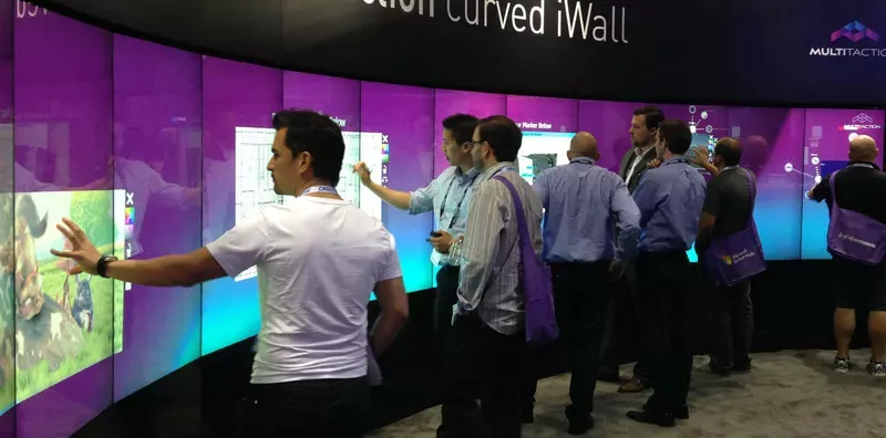 13×1 portrait ribbon of interactive displays; three rooms in a follow-the-sun handover.